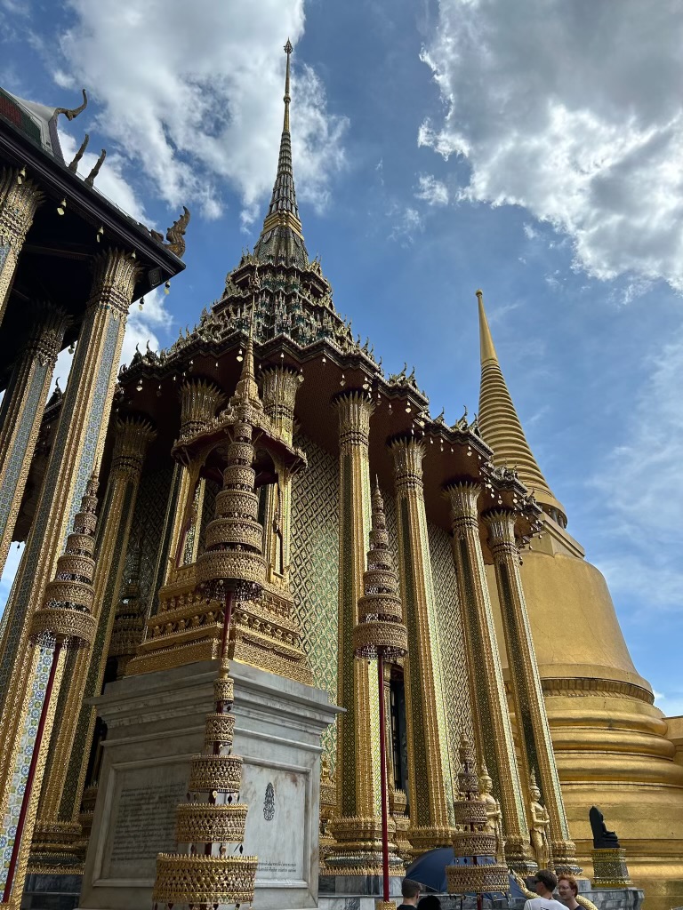 Golden spires and ornate temple architecture at the Grand Palace
